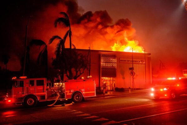 On January 8, 2025, during the Eaton fire in the Altadena neighborhood of Los Angeles county, California, a building along Lake Avenue is completely consumed by flames. Image Source: AFP