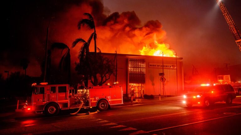 On January 8, 2025, during the Eaton fire in the Altadena neighborhood of Los Angeles county, California, a building along Lake Avenue is completely consumed by flames. Image Source: AFP