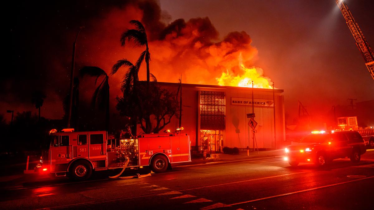 On January 8, 2025, during the Eaton fire in the Altadena neighborhood of Los Angeles county, California, a building along Lake Avenue is completely consumed by flames. Image Source: AFP